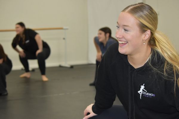 Smiling dance student in studio